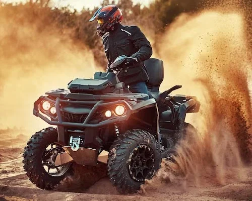 Group of riders enjoying a quad biking adventure in the desert