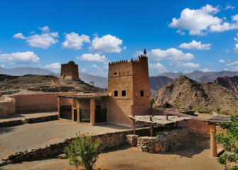 Al Hayl Castle in Fujairah surrounded by Hajar Mountains landscape